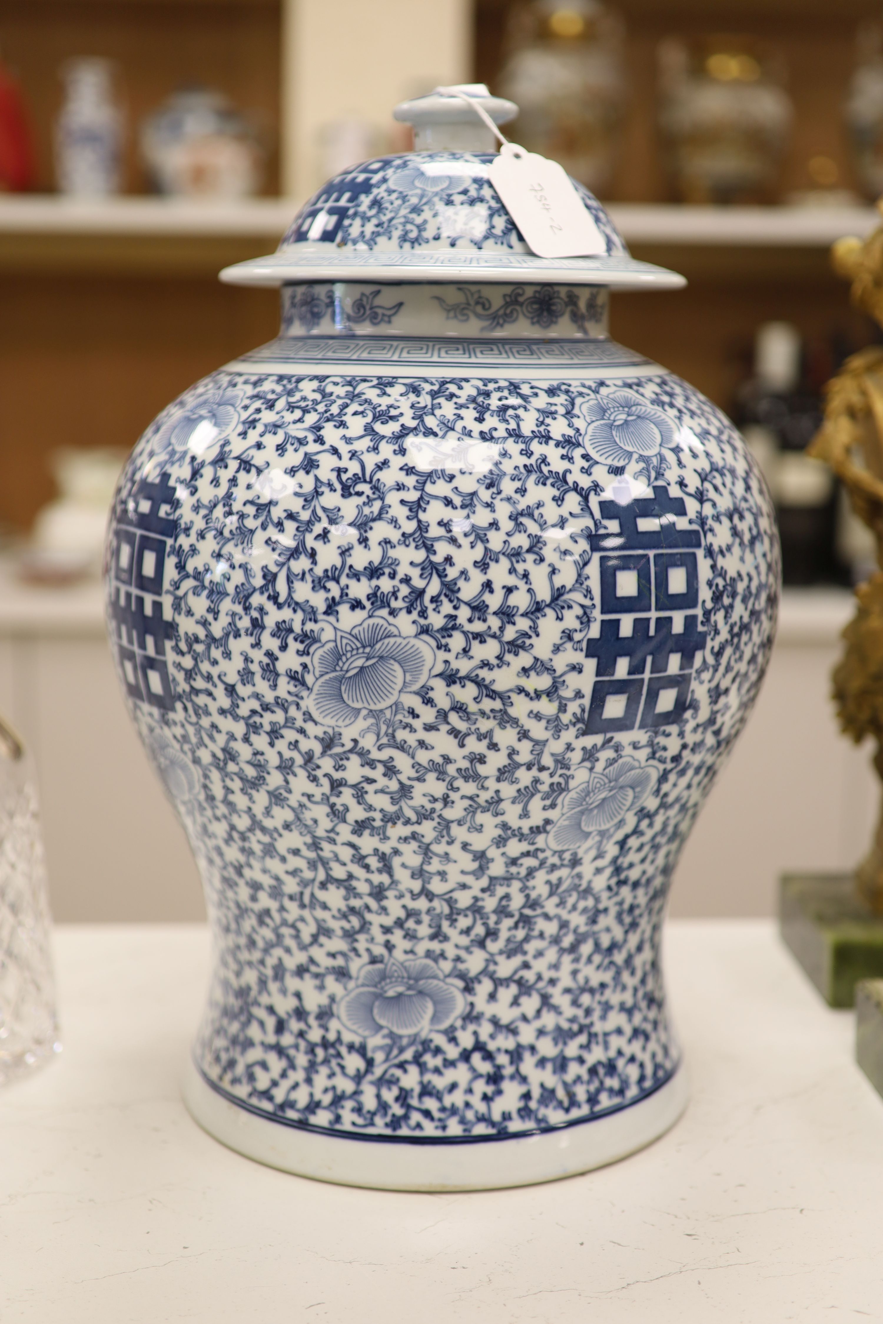 A large 20th century Chinese blue and white Shuangxi baluster vase and cover, height 32cm
